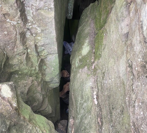 woman trapped between two huge rocks